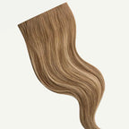 Blonde hair extension on a white background