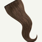 Brown hair extension on a white background