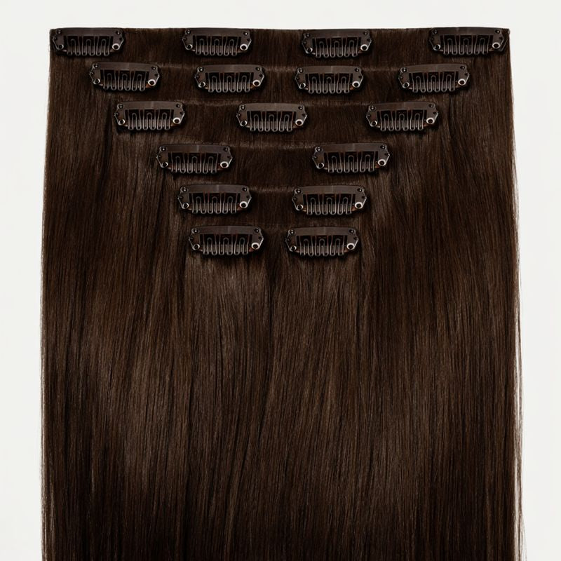 Set of hair extensions with clips on a white background