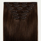 Set of hair extensions with clips on a white background